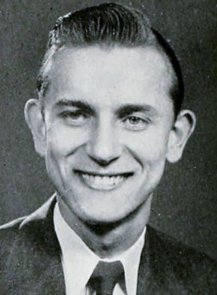A black and white photo of a young Gene L. Reese