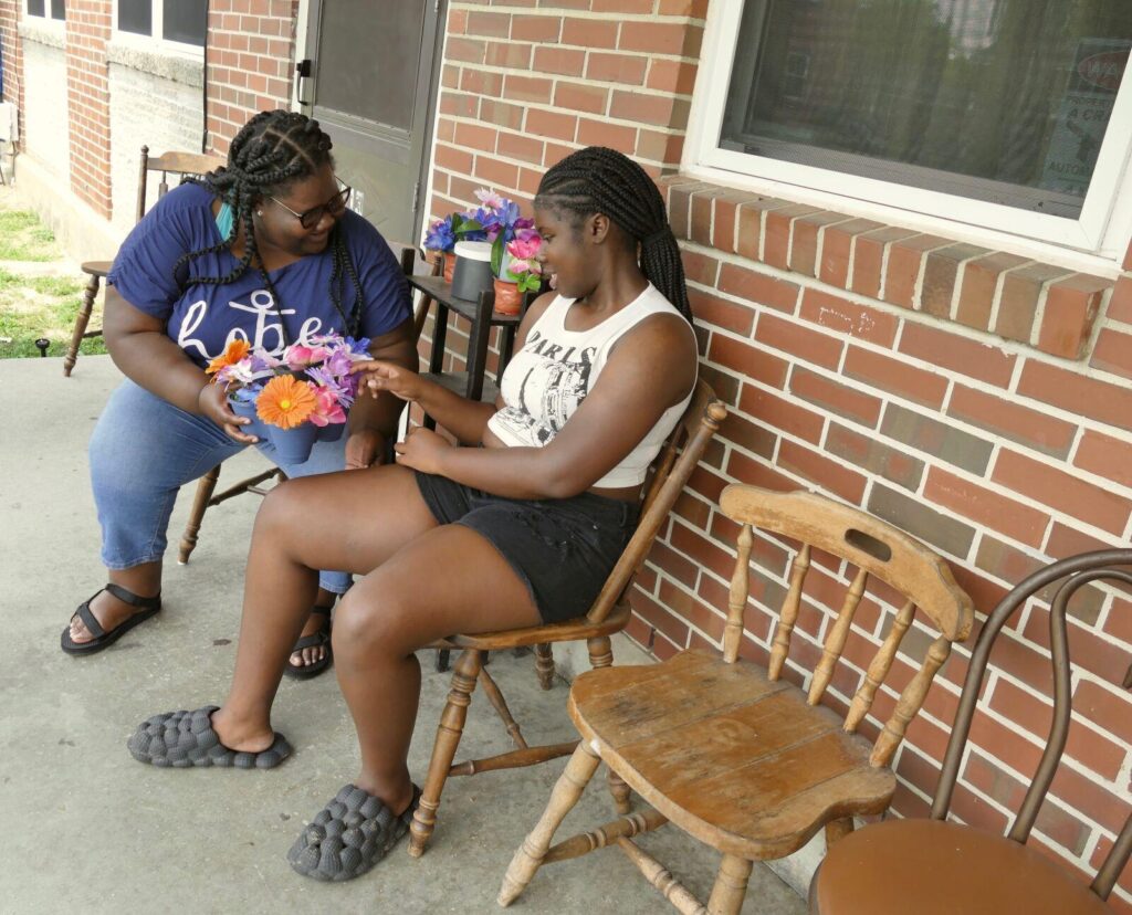 Jacobie Boone, left, and daughter Jamayah, right, outside their new apartment in Hertford. Boone recently received assistance from the Perquimans County Schools Foundation’s Helping Everyone Live Productively initiative. 