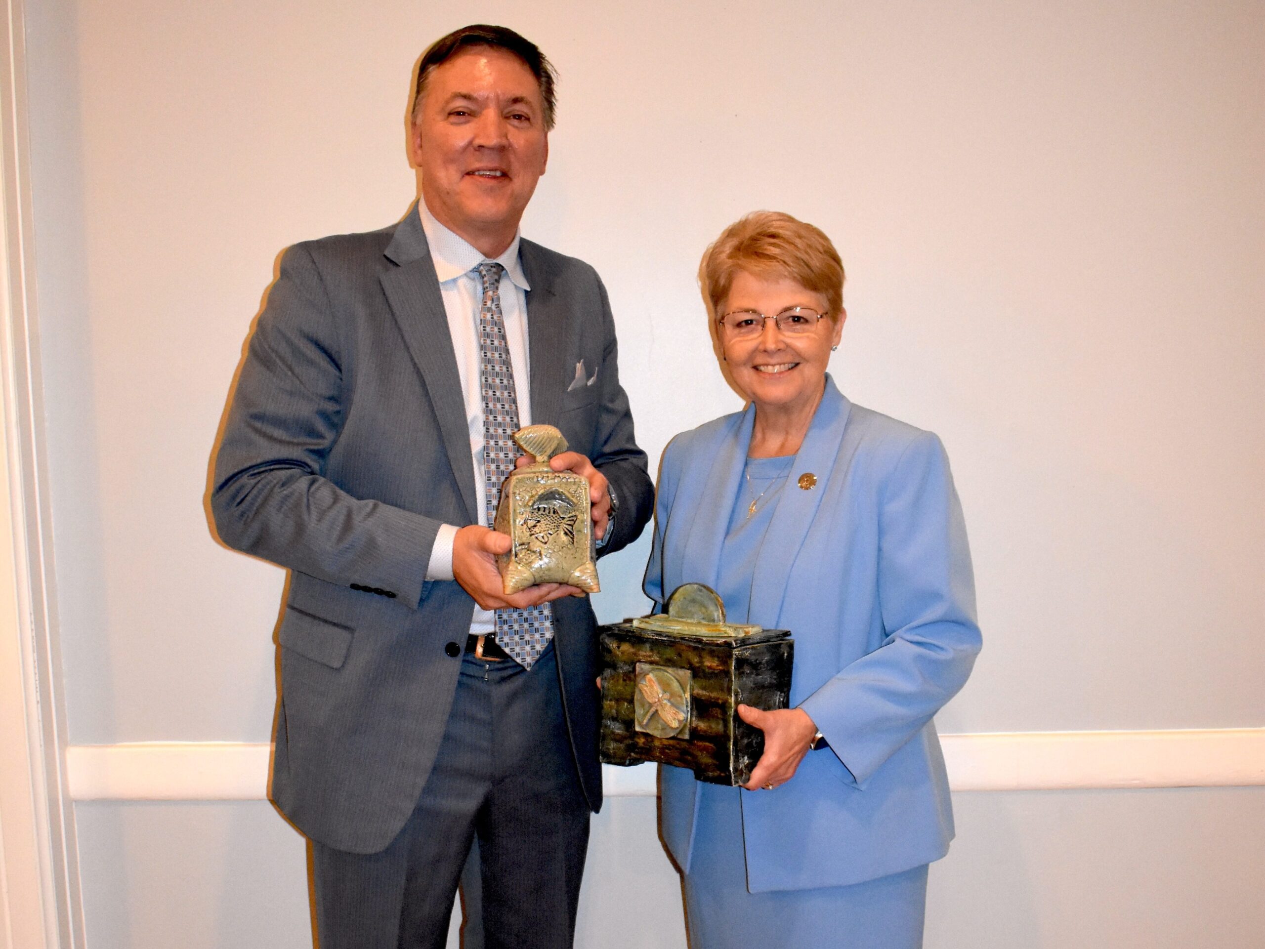 Chet Mann and Lisa Chapman pose with their awards