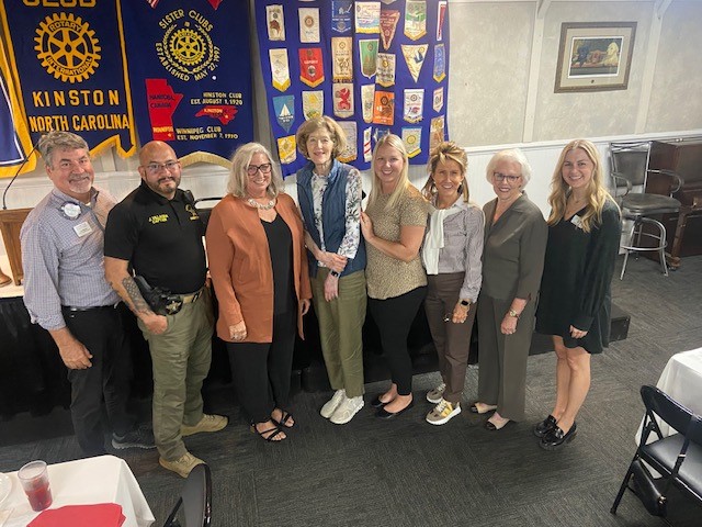 Pictured at the Kinston Rotary Meeting, from left: LCCF board member Lee Albritton, Lenoir County Sheriff’s Captain Jovanni Vallagra, LCCF President Sandy Skirving, LCCF board member Betty Blain Worthington, 3HC Patient Experience Coordinator Rachel Turner, LCCF Vice President Ann Cherry, LCCF Grants Chair Laura Pressly, NCCF Eastern Region Program Officer Abbey Lauten. Not pictured: Lenoir County Sheriff Jackie Rogers and Deputy Bre McWilliams